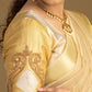 Elegant cream and gold half saree for festive wear