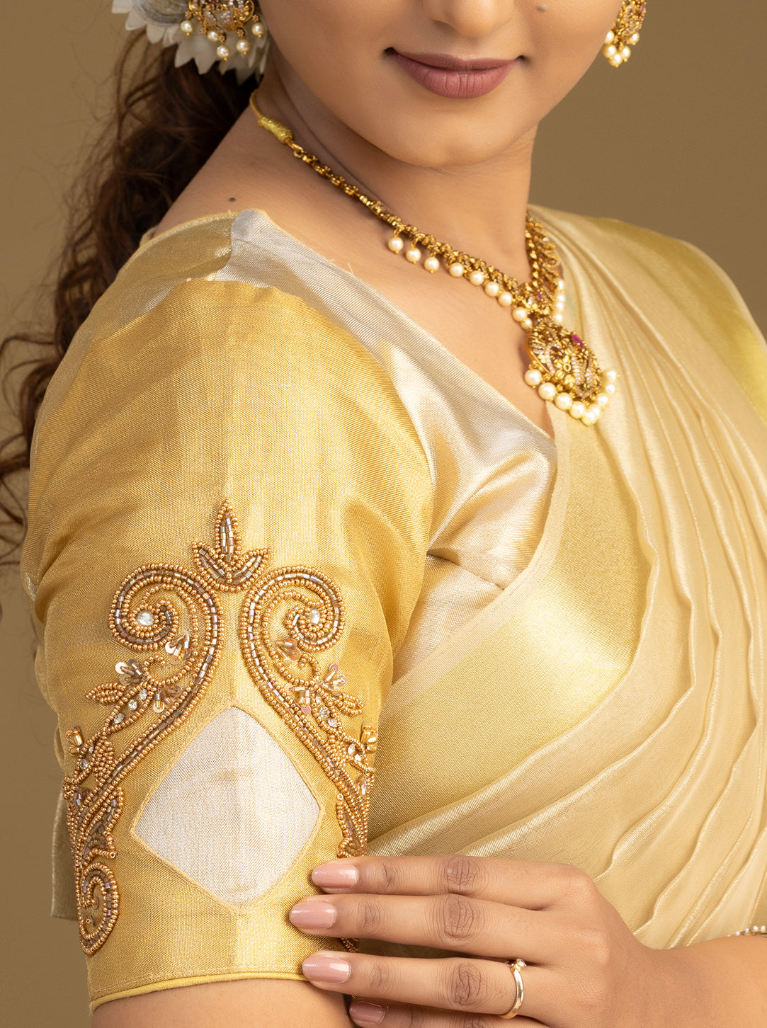 Elegant cream and gold half saree for festive wear